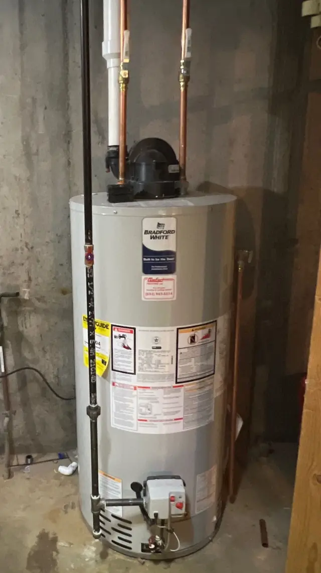 Bradford White tank water heater install with the Comfort Heating sticker on the tank