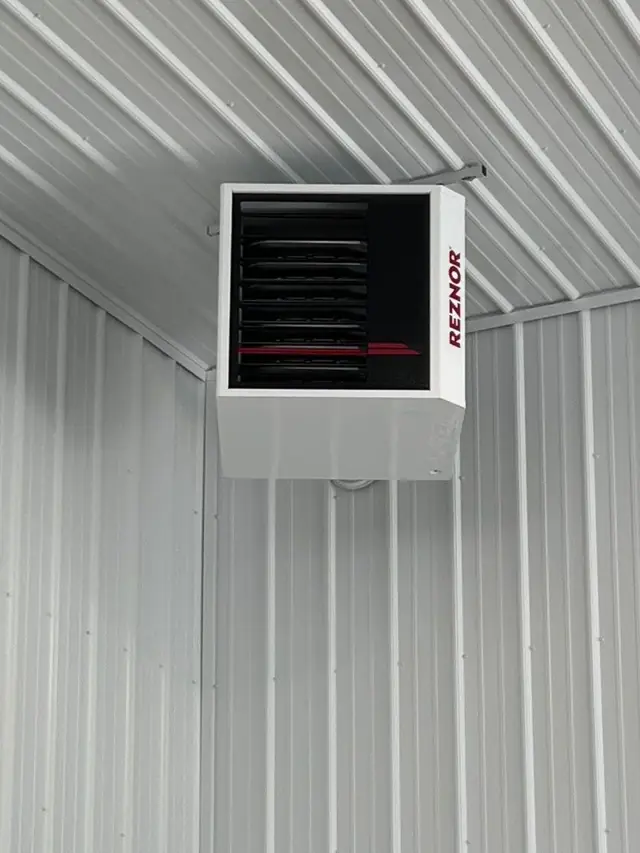 Reznor unit heater mounted in a shop or garage ceiling